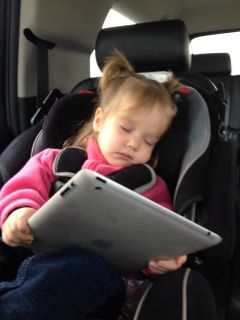 girl  asleep holding ipad 