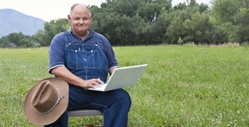 Farmer using laptop 
