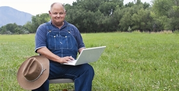 Farmer using laptop