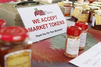 Farmer's market sign: we accept market tokens
